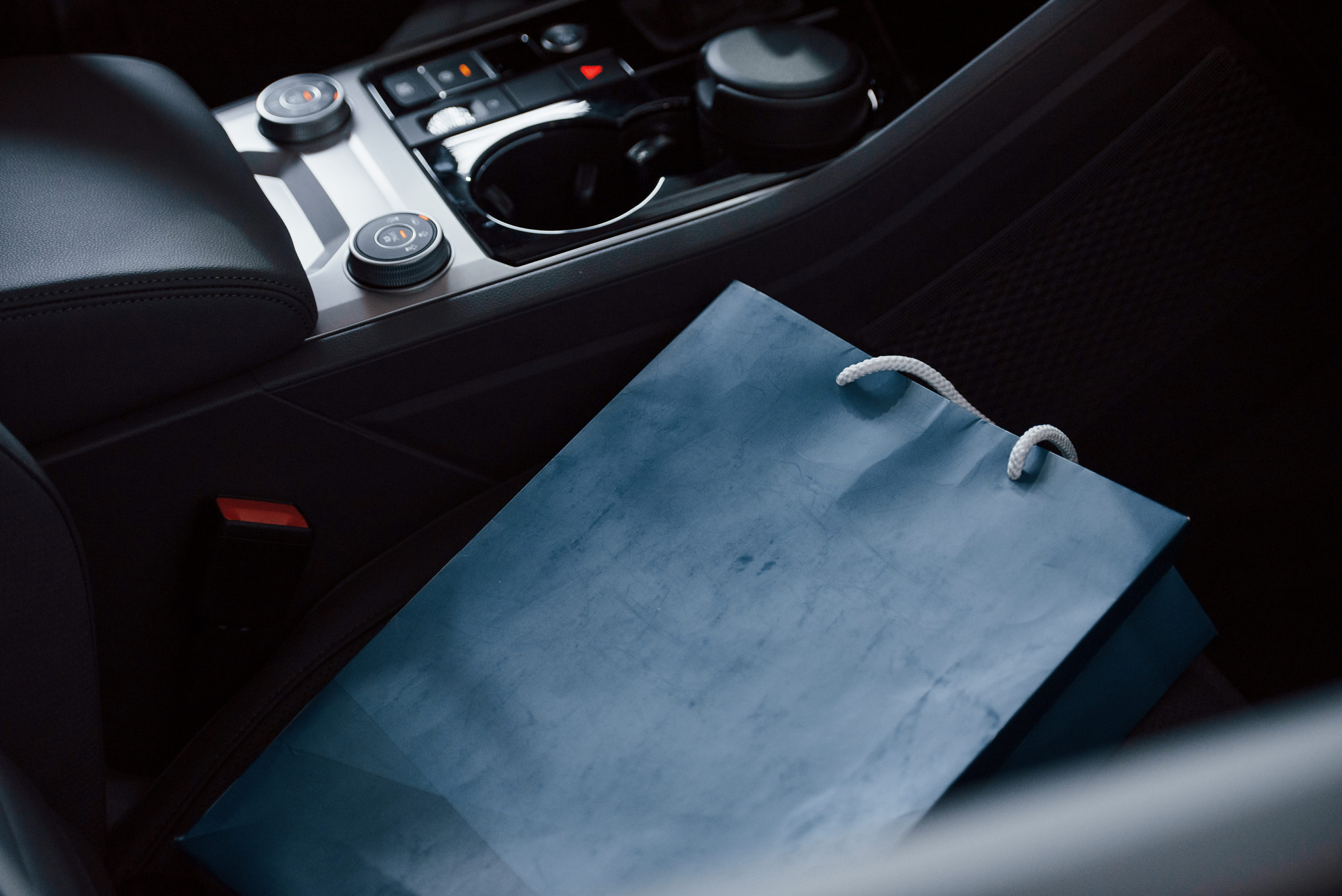 blue-bag-lying-car-close-up-view-interior-brand-new-modern-luxury-automobile (1).jpg